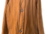 brown leather jacket on a mannequin stand with a white background