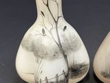 two vases that have been painted with birds on them