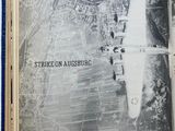 an open book with a picture of a plane flying over a city