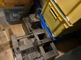 a machine that is sitting on the floor next to boxes