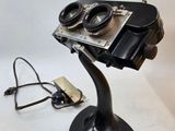 a camera that is on a stand on a table