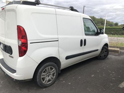 a white van that is parked in a parking lot
