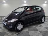 a picture of a small black car parked in a garage