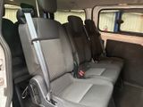 a seat in the back of a van with a remote control