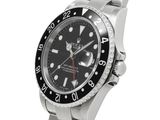 a close up of a watch on a bracelet on a white background