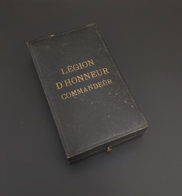 an old book sitting on top of a table next to a cup of coffee