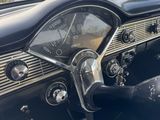 an image of a dashboard of a car with a clock on the dash