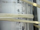 a close up of a box with a bunch of wooden sticks
