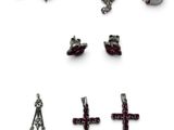 a lot of different types of jewelry on a white surface