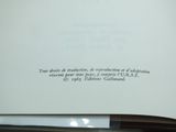 an open book with writing on it sitting on a table