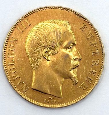 an image of a close up of a gold coin with a man ' s face