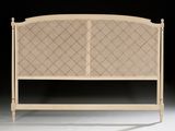 a bed with a headboard made of wood and wicker
