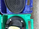 a green box with a black lid and a blue box with a green lid