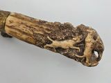 an elephant head on the handle of a cane