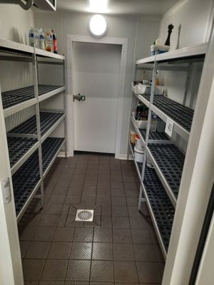 an image of a room with a bunch of shelves