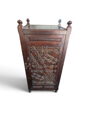 a wooden cabinet with a glass top on a white background