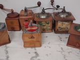 many different types of coffee grinders on a table