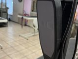 a cell phone that is attached to the back of a chair