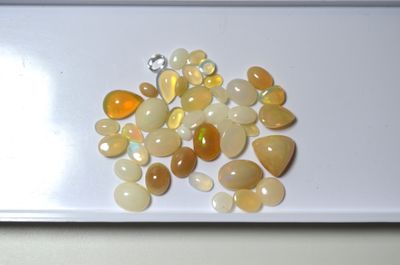 a white plate with some yellow and white stones on it