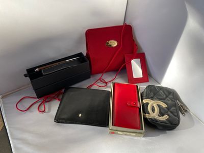 a lot of purses and wallets sitting on a table