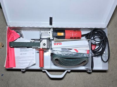 a box with tools inside of it on the floor