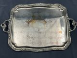 an antique silver tray with handles and handles on a black background