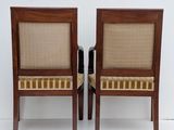 pair of mid century style chairs in the manner of person
