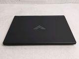 a laptop that is sitting on a white surface