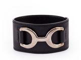 a black leather bracelet with two horseshoes on it