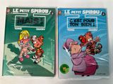 two books on a white surface with a cartoon character on the cover