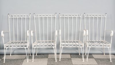 three white metal chairs sitting next to each other on top of a checkered floor