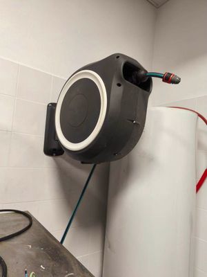 a speaker that is connected to the wall in the bathroom