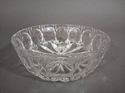 a glass bowl that is sitting on a table
