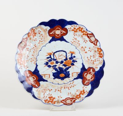 a close up of a plate with a flower design on it