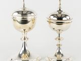 pair of silverplated candlesticks with a domed top