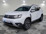 the white dacia is parked in a room with a checkered floor