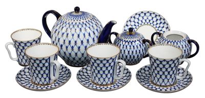 blue and white porcelain tea set with matching cups and saucers