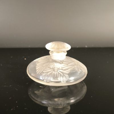an image of a glass candle holder on a table