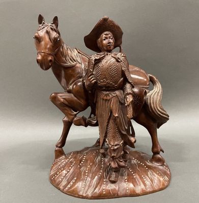 bronze statue of a man on a horse with a hat on his head