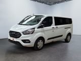 the white van is parked in a large room with white walls