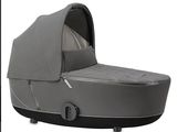 an image of a baby stroller with a cover on it