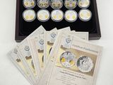 several silver coins are in a wooden case on a white table