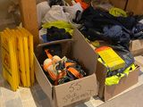 many boxes of clothes and other items on the floor