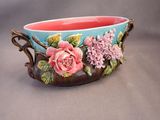 a bowl with flowers painted on it on a table