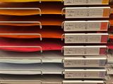 many folders stacked on top of each other on a shelf