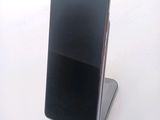 a cell phone that is sitting on top of a stand
