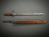 an old knife and a wooden sheath on a black background