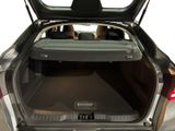 a trunk of a car with a bed in the back