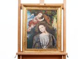 un tableau posé sur un chevalet, représentant une femme
