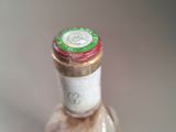 a bottle of wine that is sitting on a table